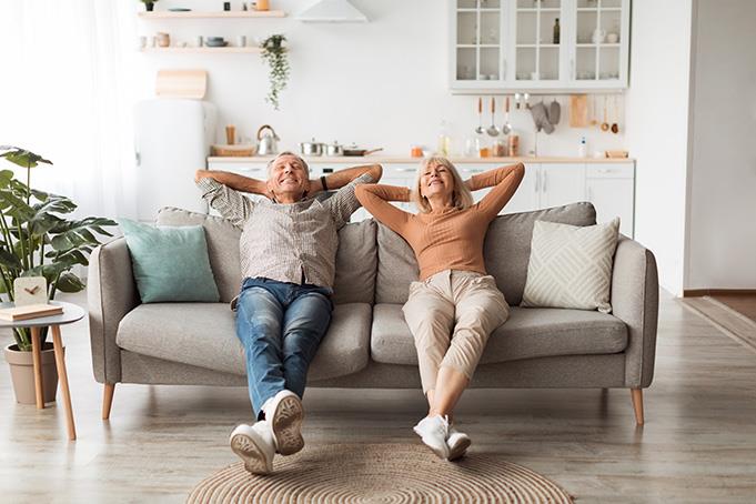 Retired couple relaxing on a couch